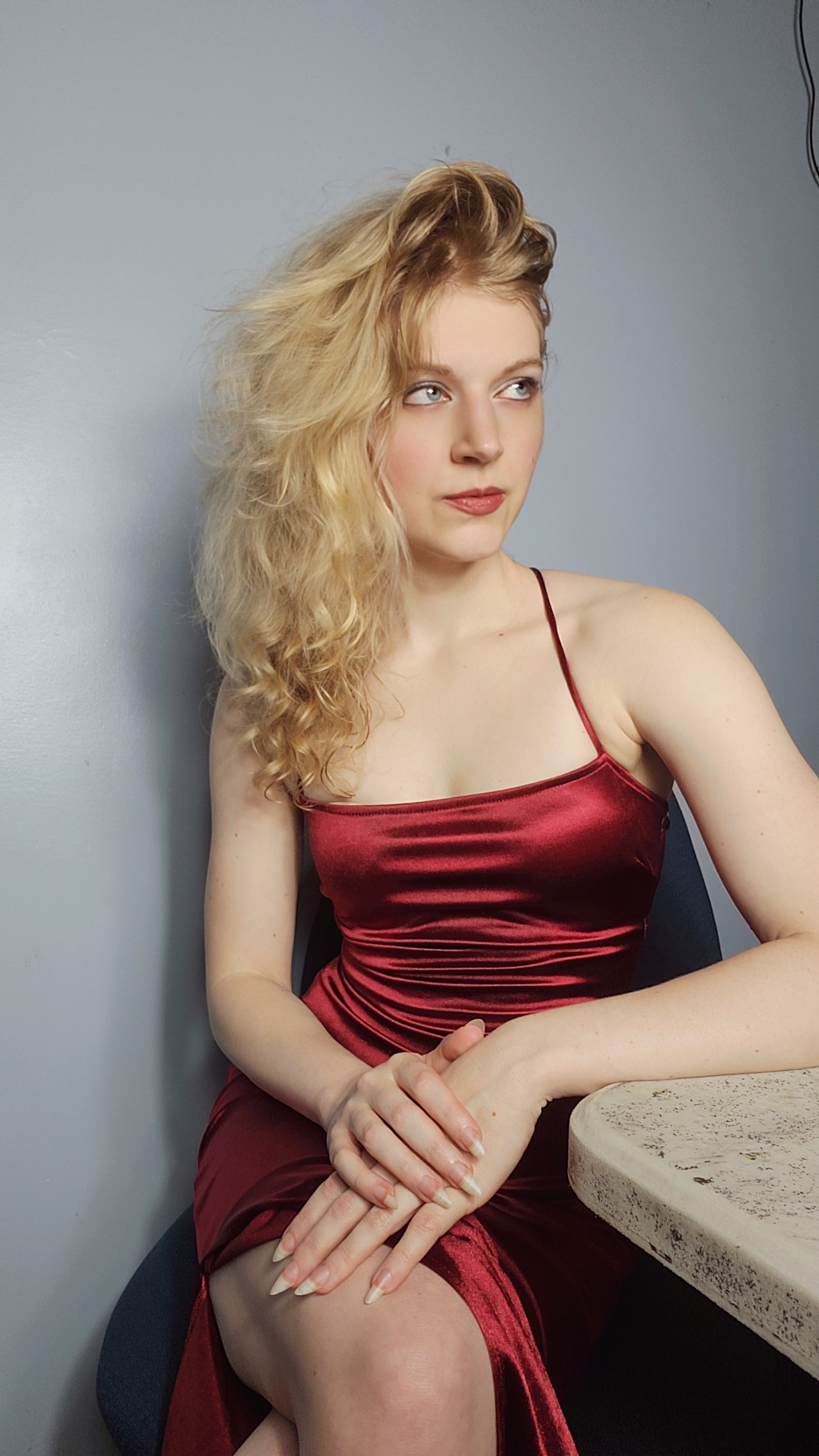 Amanda in a red dress, seated portrait